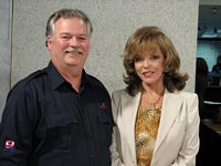 Phil Konstantin and Joan Collins